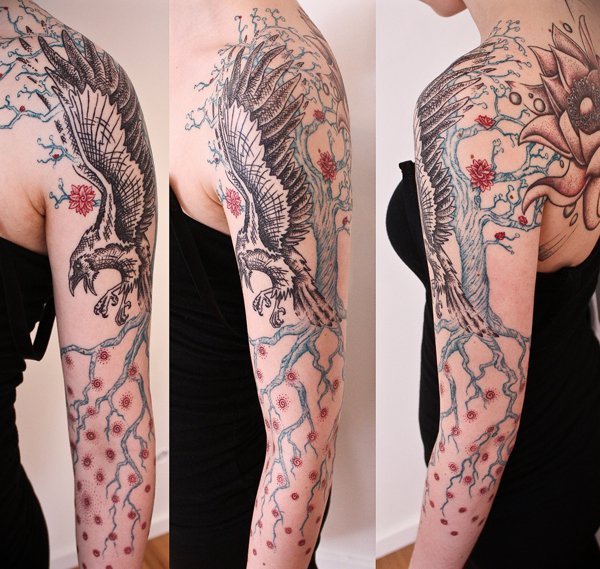 Flying Raven Tattoo On Left Sleeve