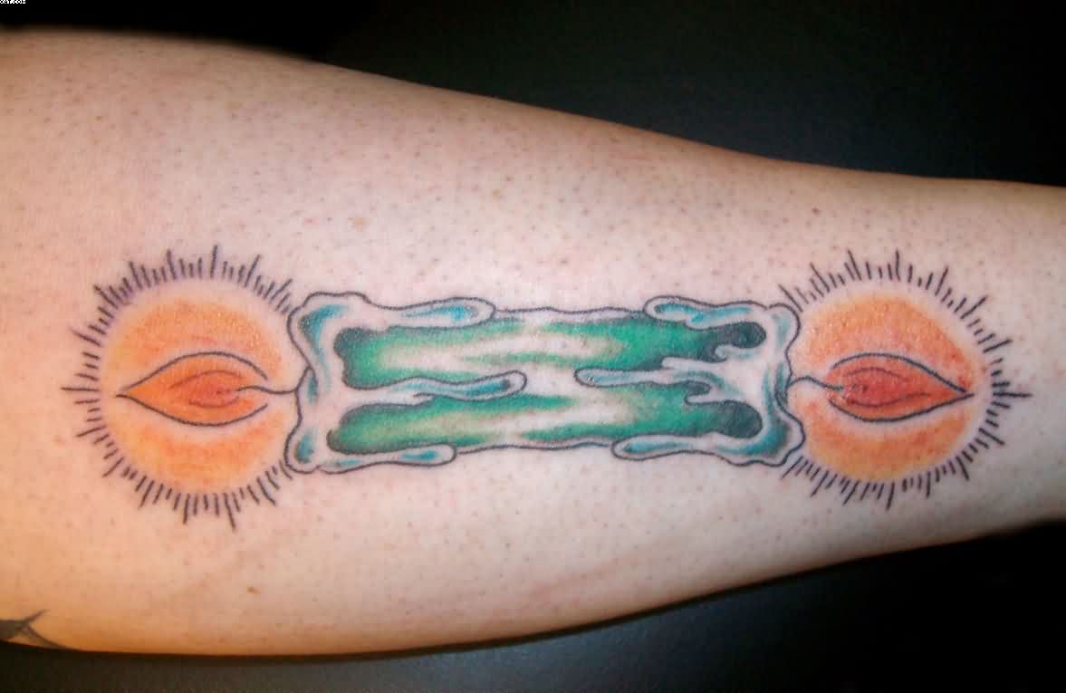 Green Candle Burning At Both Ends Tattoo on Forearm