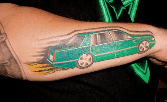 Green Car Tattoo On Right Arm