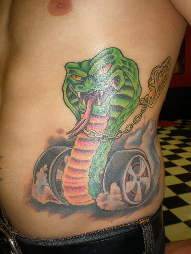 Green Snake Car Tattoo on Man Side Rib
