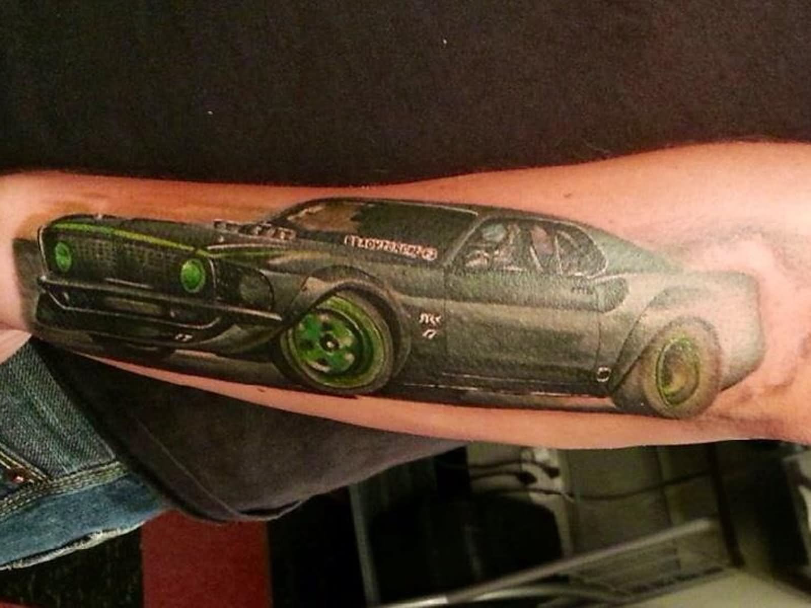 Green Wheels Car Tattoo On Arm For Guys