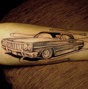 Grey Car Tattoo On Left Forearm