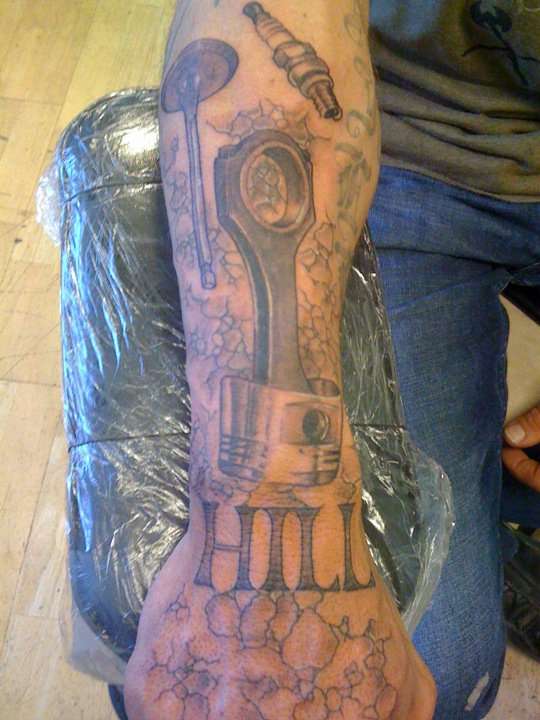 Grey Ink Car Parts Tattoo On Right Arm