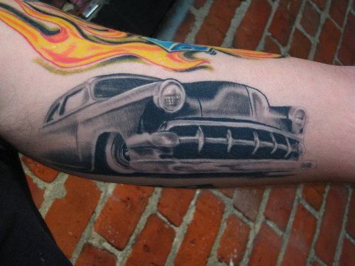 Grey Ink Car Tattoo On Bicep