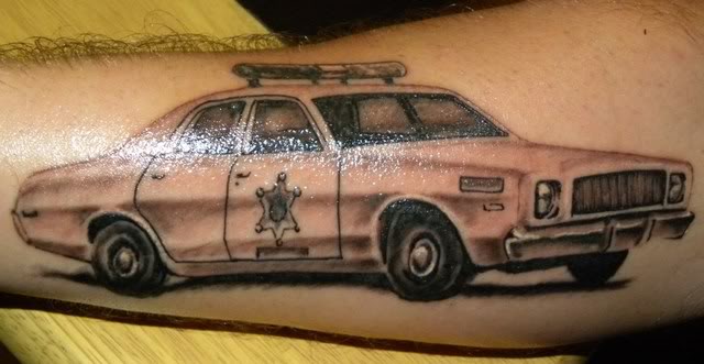 Grey Ink Car Tattoo On Forearm