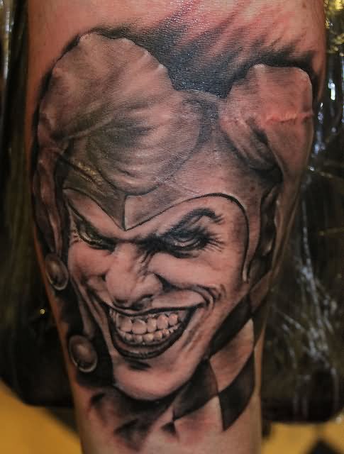 Grey Ink Evil Joker Head Tattoo