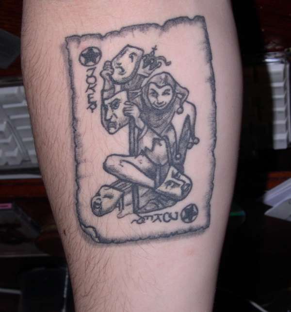 Grey Ink Joker Card Tattoo On Forearm
