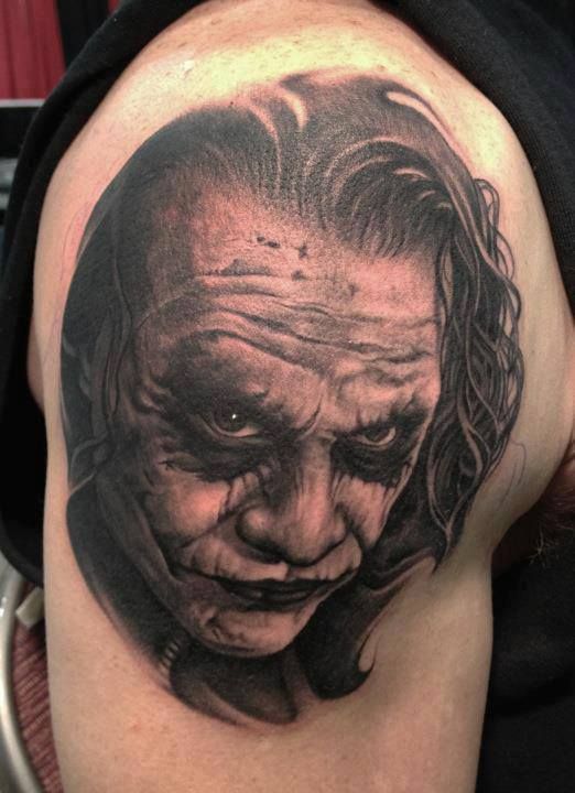 Grey Joker Head Tattoo On Shoulder