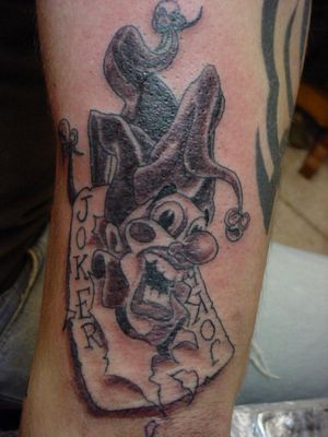 Joker Card Tattoo On Left Arm
