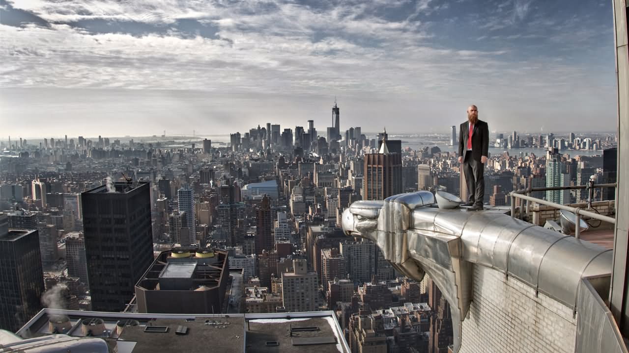 Logan Hicks Standing On The Edge Of The Chrysler Building