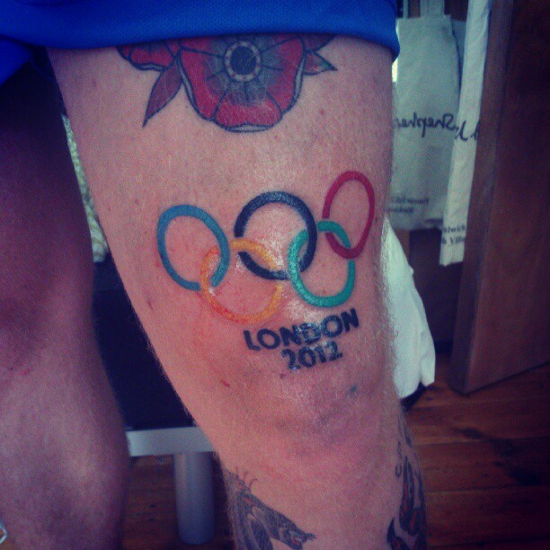 London 2012 - Colorful Olympic Symbol Tattoo On Thigh