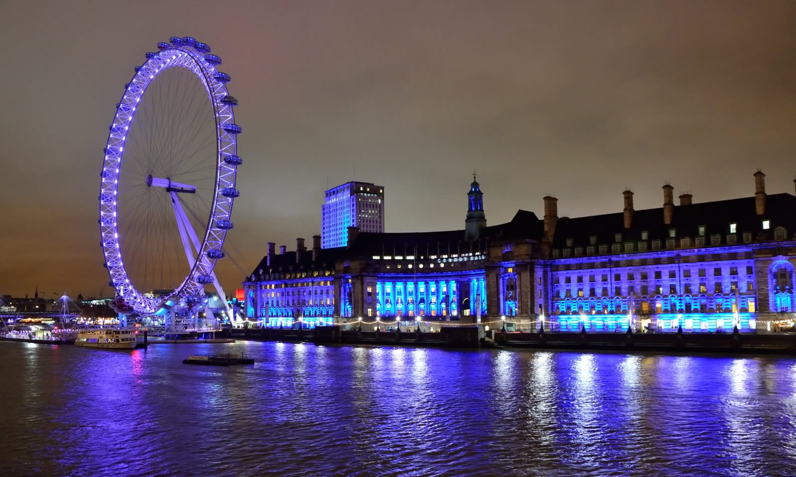 London Eye On The Bank Of River Thames Night View