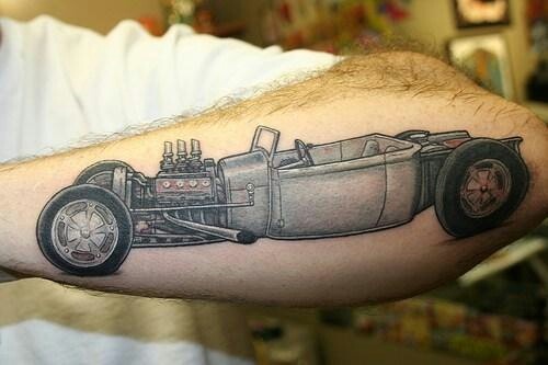 Nice Grey Ink Racing Car Tattoo On Left Arm