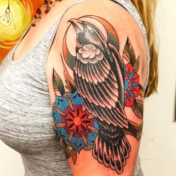 Nice Traditional Raven Tattoo On Girl Left Shoulder