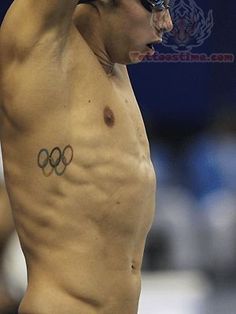 Olympic Symbol Tattoo On Man Right Side Rib