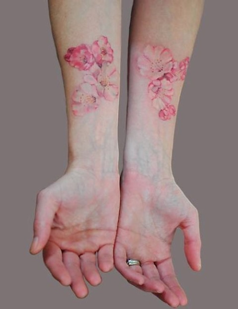 Pink Ink Feminine Flowers Tattoo On Both Forearm