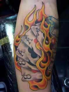 Playing Cards In Fire And Flame Tattoo Design For Forearm