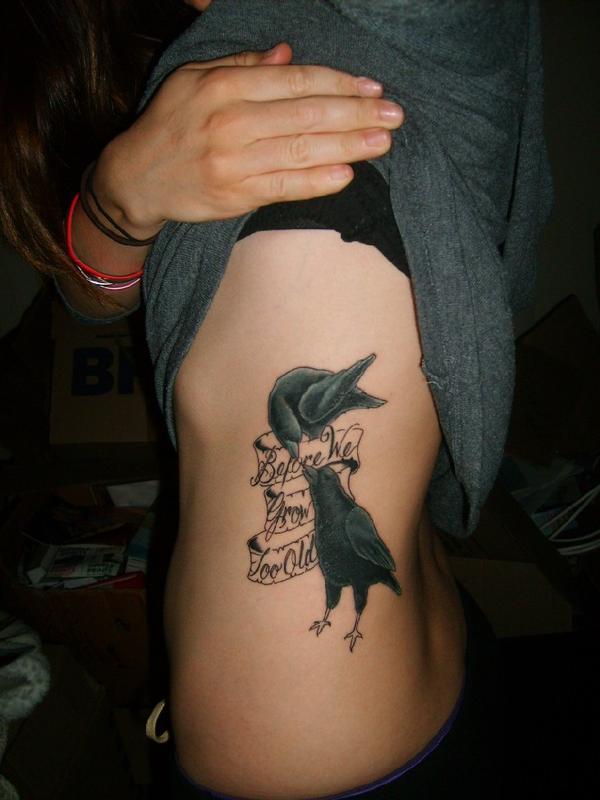 Poe Raven Tattoo On Girl Side Rib by Trackersgirl