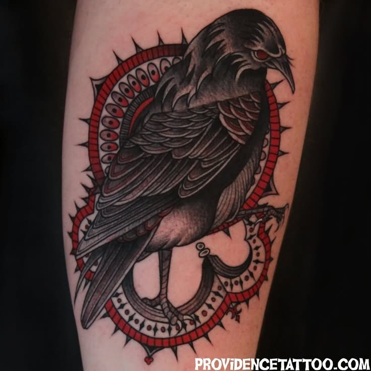 Red Eye Traditional Raven Tattoo On Arm