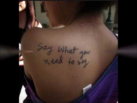 Simple Feminine Script Tattoo On Girl Left Back Shoulder.