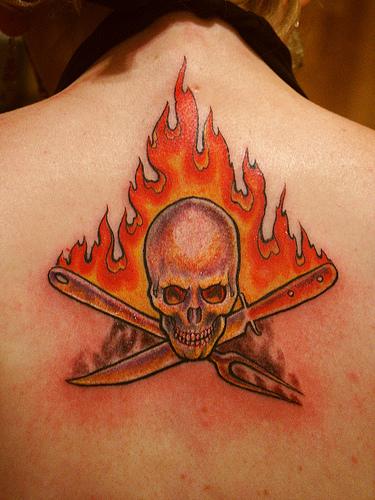Skull In Fire And Flame Tattoo On Upper Back