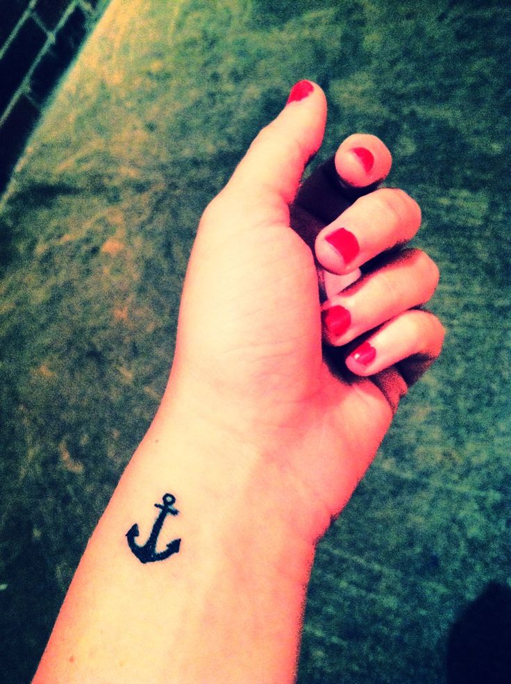 Small Black Ink Anchor Tattoo On Left Wrist