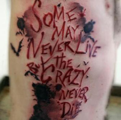 Some May Never Live But the Crazy Never Die - Joker Quote Tattoo On Side Rib