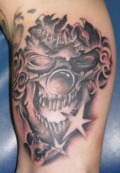 Stars And Joker Face Tattoo On Bicep