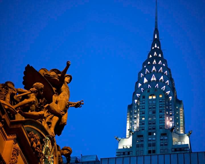 Statues In Front Of Chrysler Building At Night