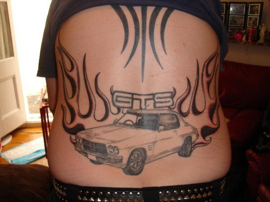Tribal Flames And Car Tattoo on Lower Back