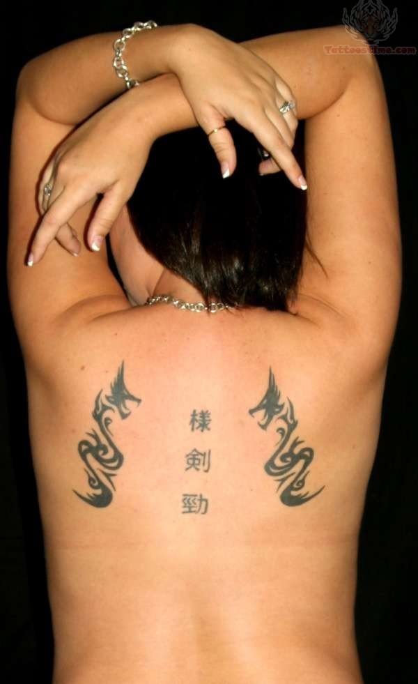 Two Tribal Dragon With Kanji Tattoo On Girl Upper Back