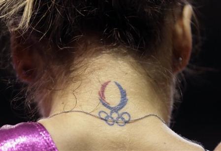 Unique Olympic Symbol Tattoo On Girl Back Neck