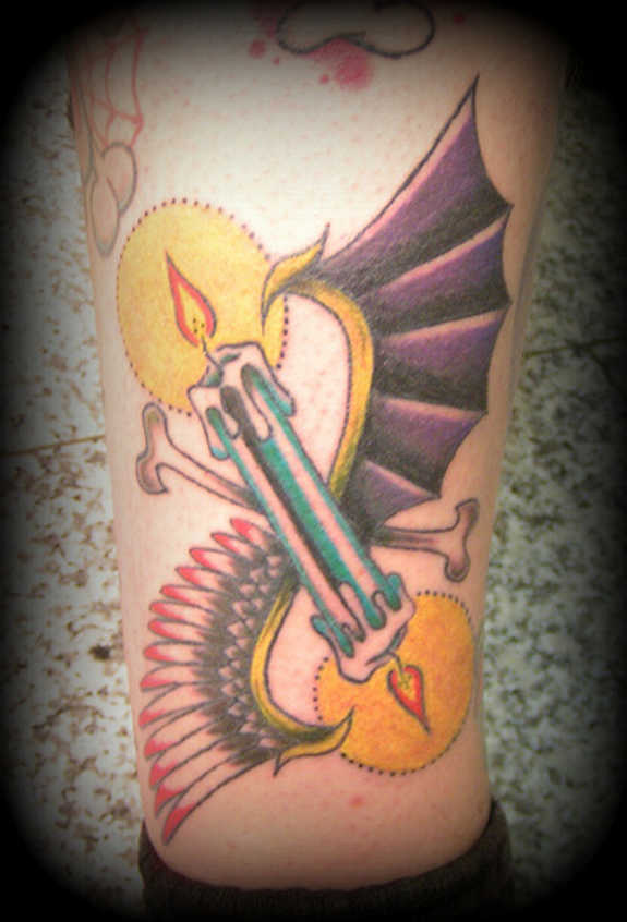Winged candle burning on both sides tattoo on leg