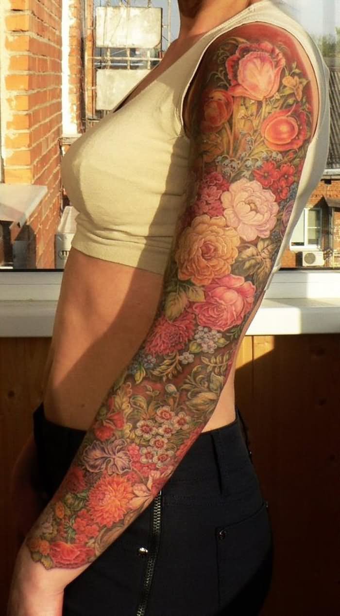 Wonderful Colorful Feminine Flowers Tattoo On Girl Left Full Sleeve