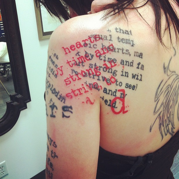 Attractive Literary Tattoo On Girl Left Sleeve