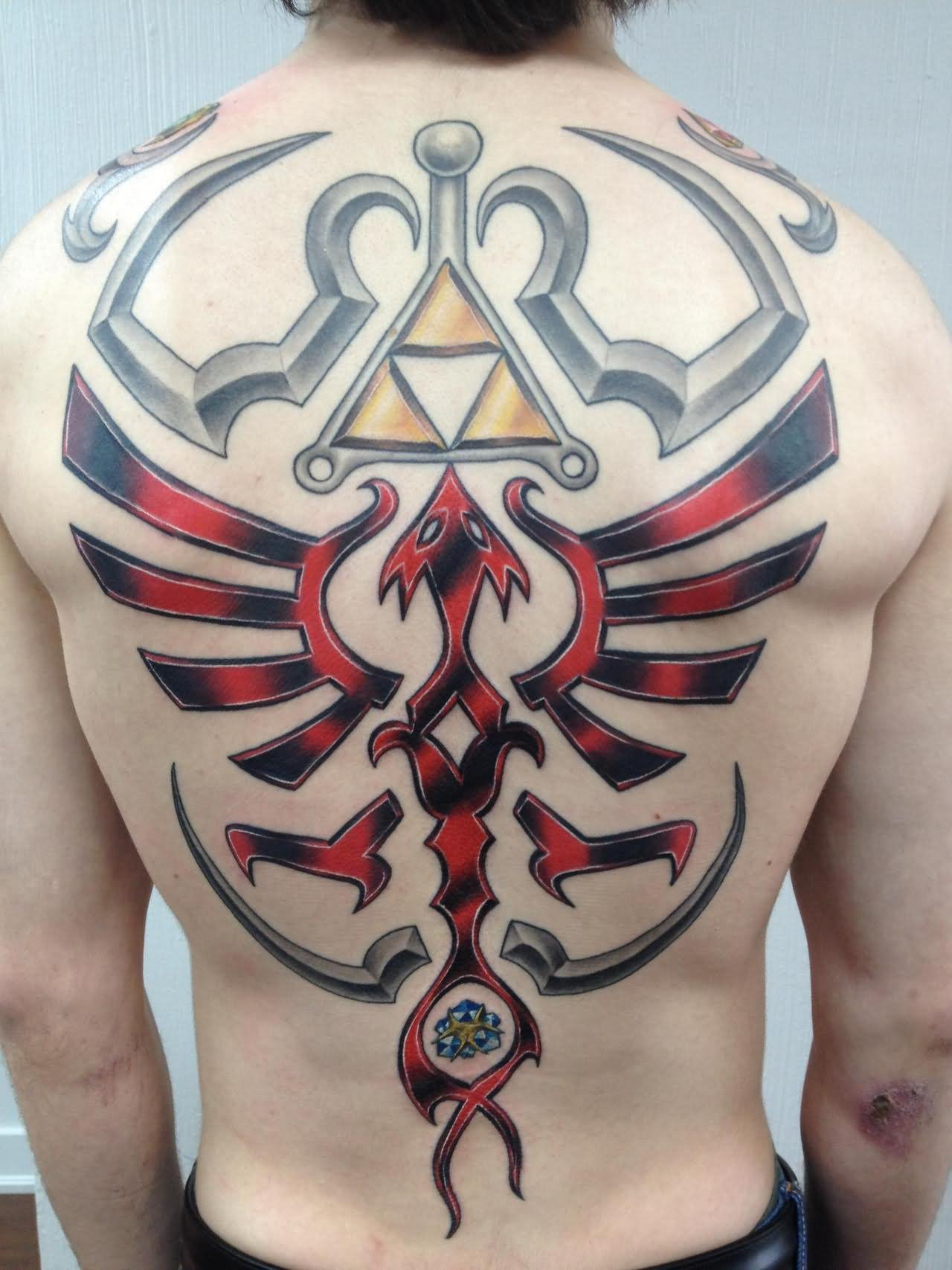 Beautiful Zelda Crest Video Game Tattoo On Back by Alie K