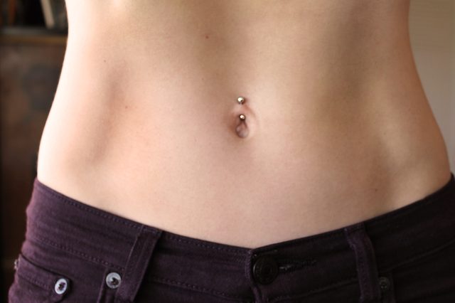 Belly Button Piercing With Gold Barbell
