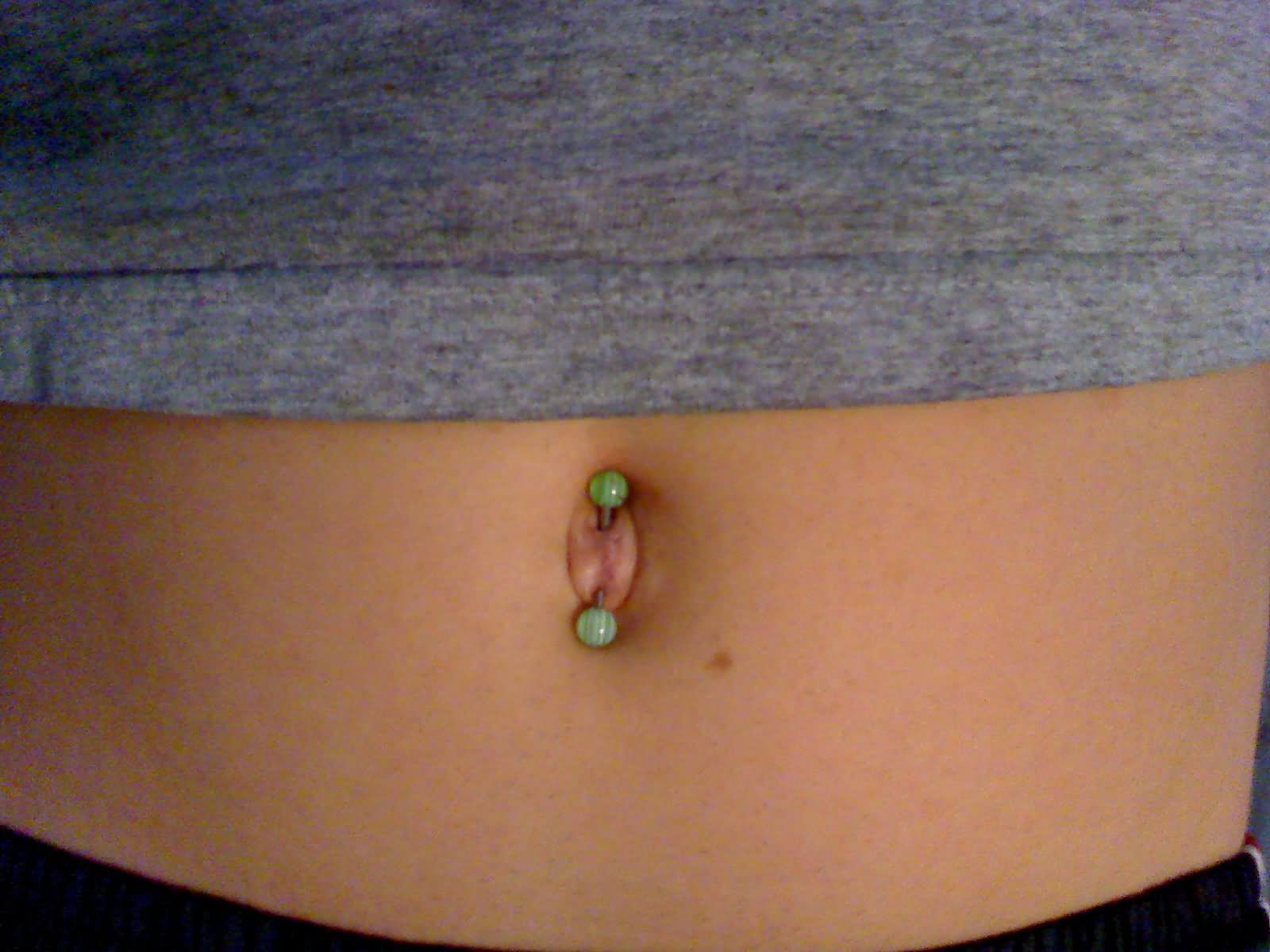 Belly Piercing With Green Barbell