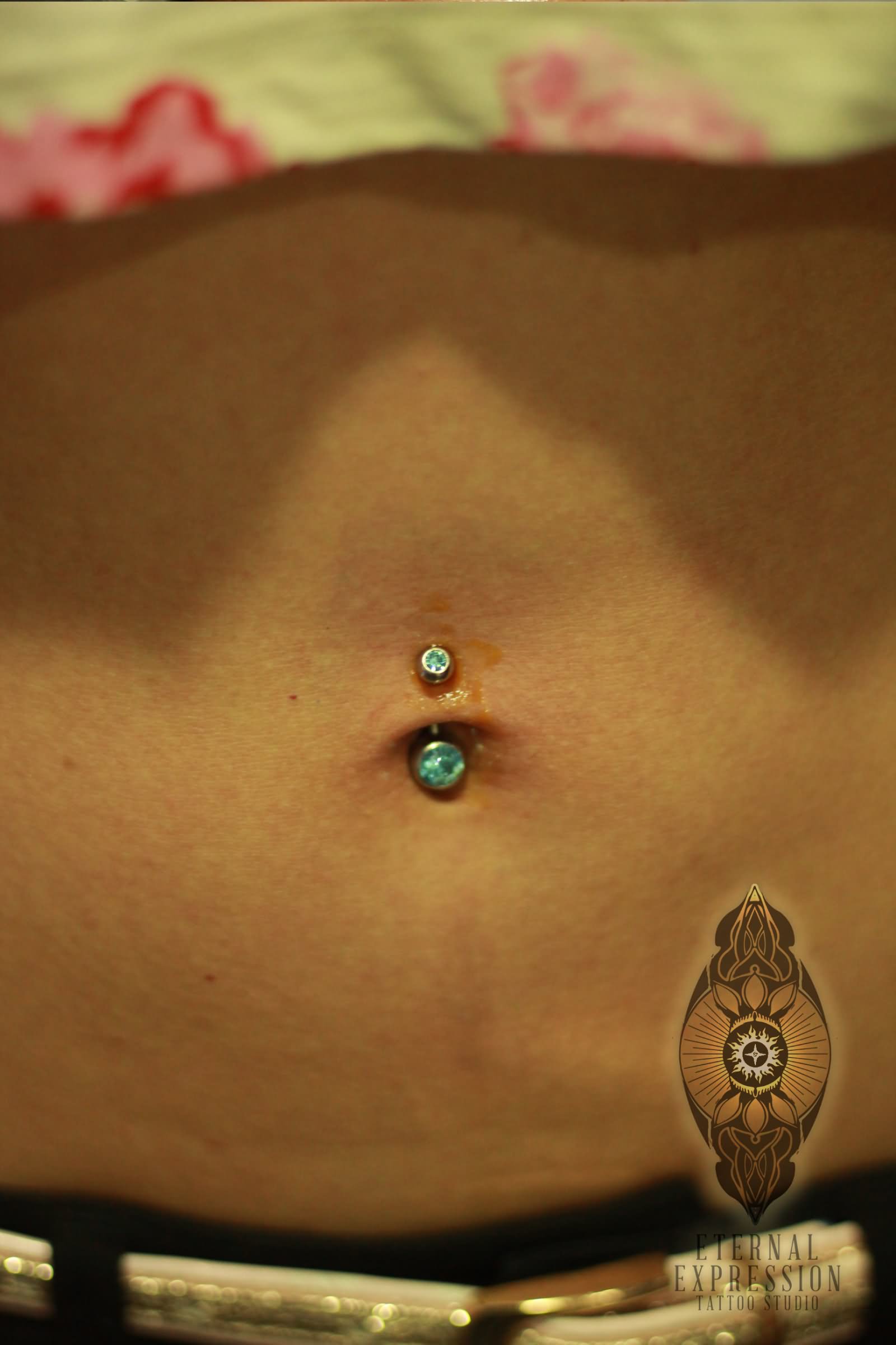 Belly Piercing With Green Stud