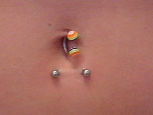 Belly Piercing With Surface Barbell And Circular Ring