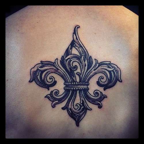 Black And Grey Fleur De Lis Tattoo On Upper Back