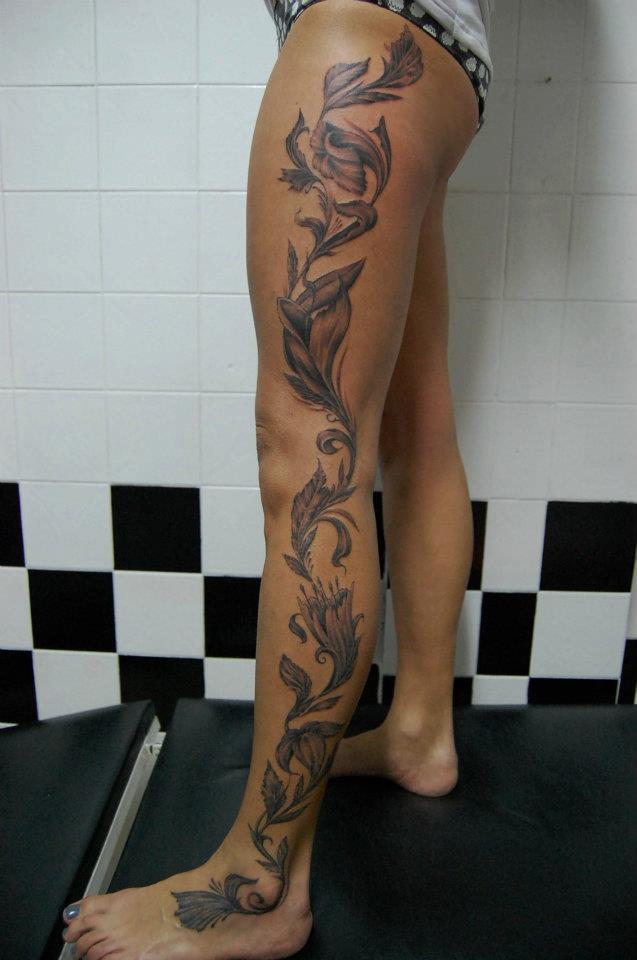 Black And Grey Flowers Tattoo On Girl Full Leg