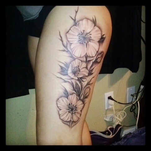 Black And Grey Flowers Tattoo On Left Upper Leg