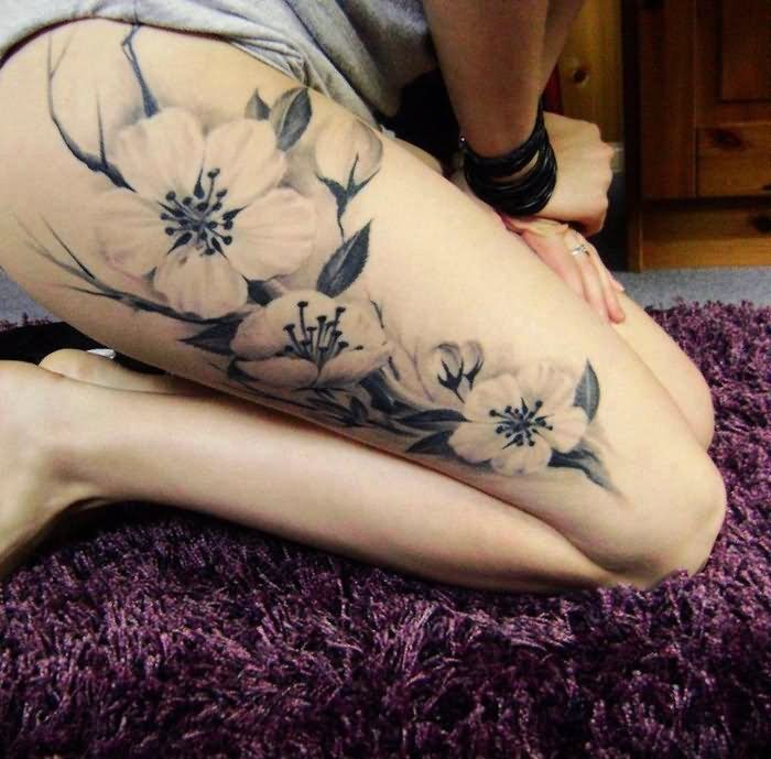 Black And Grey Flowers Tattoo On Right Upper Leg