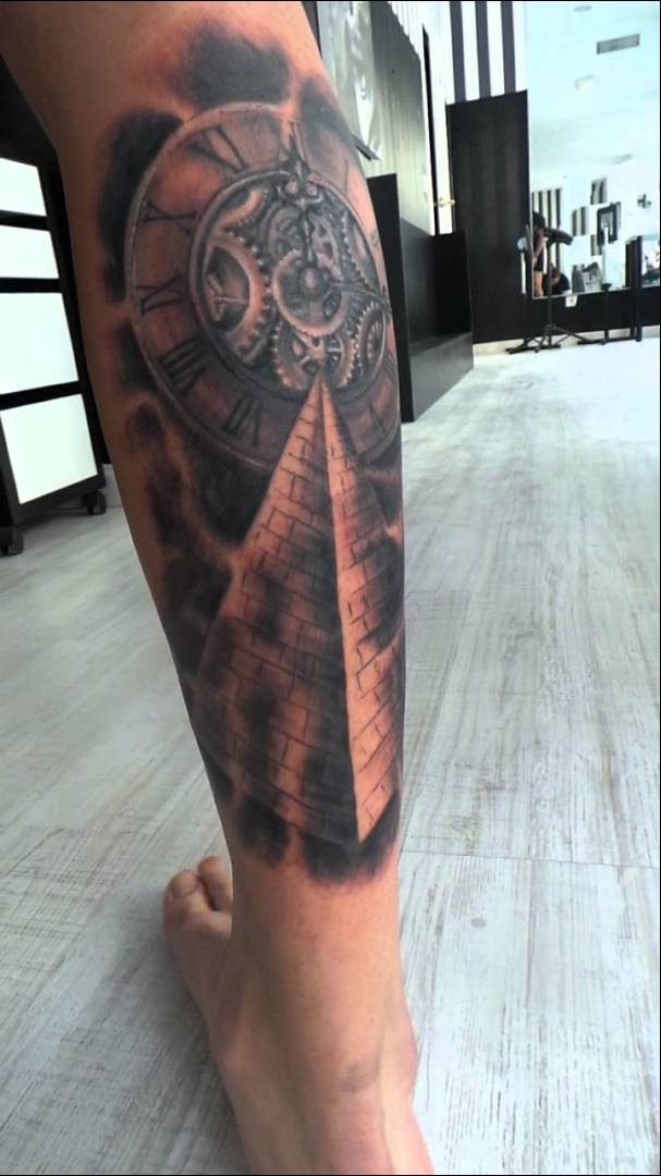 Black And Grey Pyramid Clock Tattoo On Leg