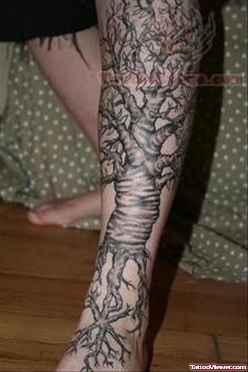 Black And Grey Tree Tattoo On Left Leg