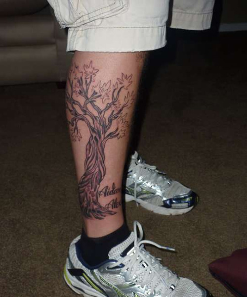 Black And Grey Tree Tattoo On Right Leg