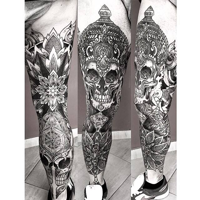 Black And White Skull With Flowers Tattoo On Leg