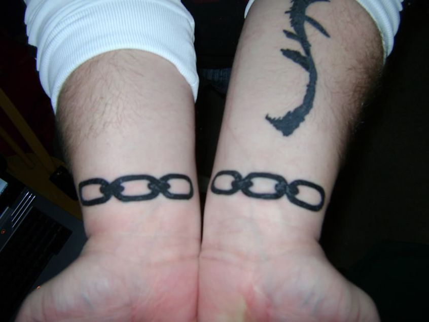 Black Chain Video Game Tattoo On Wrist