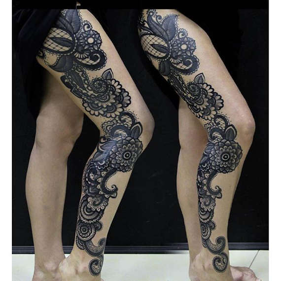 Black Ink Flowers Tattoo On Right Leg